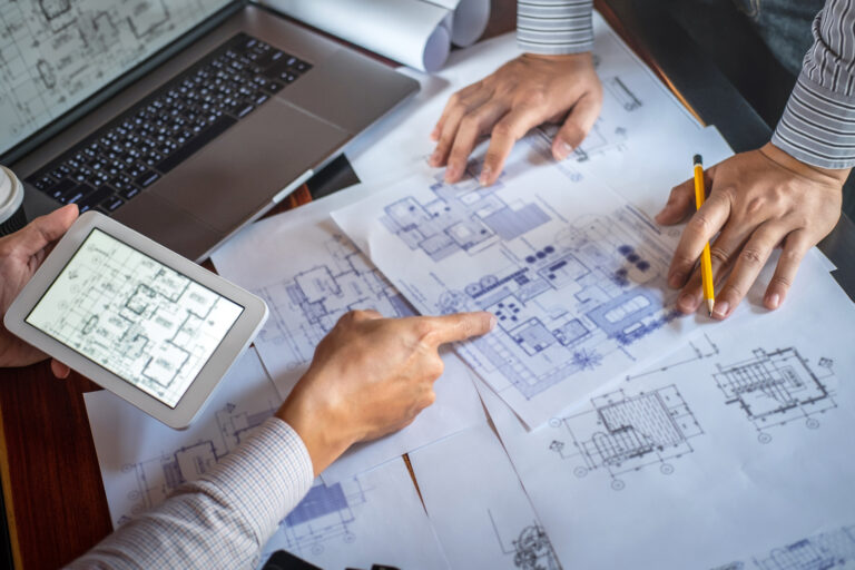 Person using a tablet during home design planning, technology in interior design