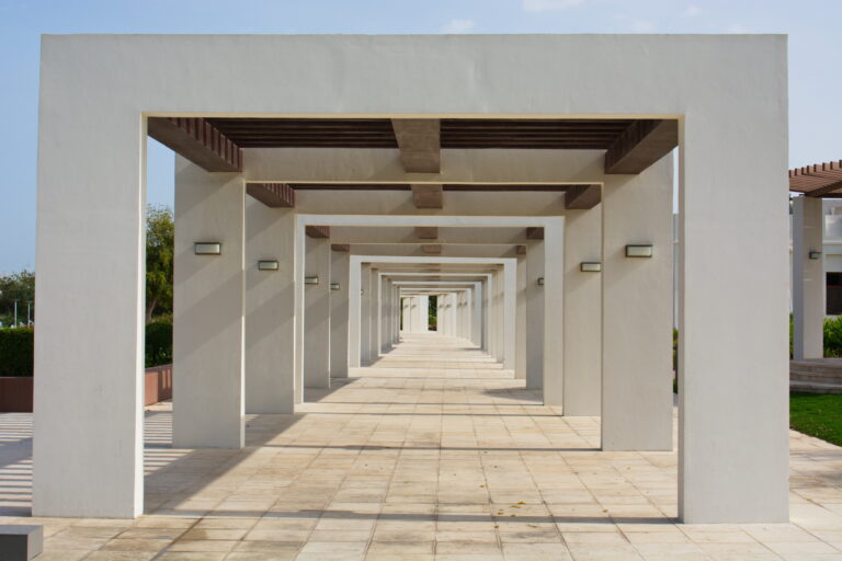 Clean white home corridor, accessible hallway design for aging in place