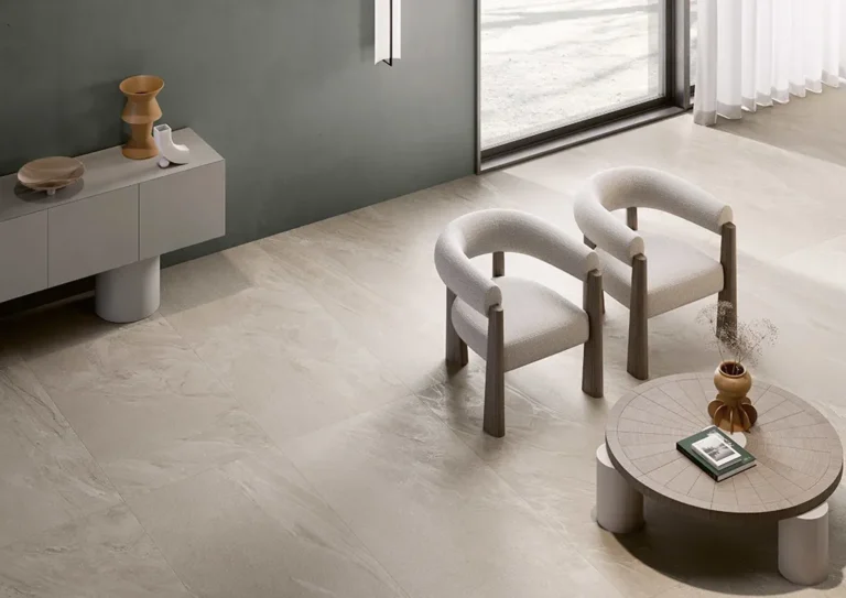 Bathroom floor detail with a curved plaster stool and a low side table