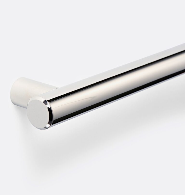 Close up of a polished chrome grab bar and its rounded end flange
