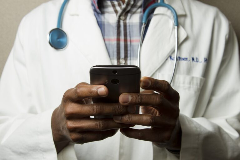 Person reviewing health data on tablet for wellness protocol